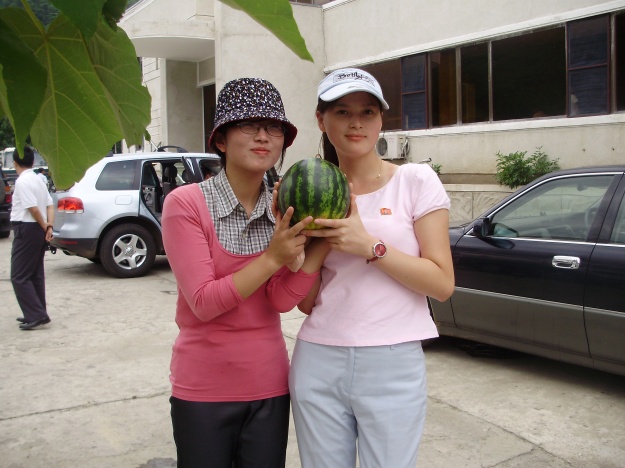 Nina's friends are showing a water melon